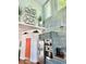 Kitchen featuring stainless appliances, custom cabinetry, wood countertops and floors and corrugated steel wall at 417 S Palmetto Ave, Daytona Beach, FL 32114