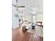 Bright living room featuring a decorative ceiling, hardwood floors, and an open floor plan to the kitchen at 417 S Palmetto Ave, Daytona Beach, FL 32114