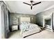 Beautiful main bedroom with decorative wall, ceiling fan and modern decor at 417 S Palmetto Ave, Daytona Beach, FL 32114