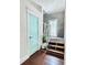 Modern staircase with wood treads and metal railings with custom paint color doors at 417 S Palmetto Ave, Daytona Beach, FL 32114