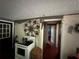 Traditional kitchen area showing the oven with a view into the next rooms at 43721 State Road 19, Altoona, FL 32702