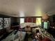 Eclectic living room features decor, ample space, and natural light from the windows at 43721 State Road 19, Altoona, FL 32702