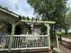 Covered porch features a decorative pergola and a view of the yard at 43721 State Road 19, Altoona, FL 32702