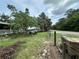 Expansive yard with a cozy fire pit area and mature shade trees, perfect for outdoor enjoyment at 43721 State Road 19, Altoona, FL 32702
