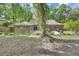 Charming backyard with brick house, patio, and ample seating at 535 Black Ironwood Dr, Deland, FL 32724