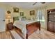 Comfortable bedroom with wood floors and large window at 535 Black Ironwood Dr, Deland, FL 32724