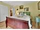 Bedroom with wood floors and door leading to another room at 535 Black Ironwood Dr, Deland, FL 32724
