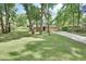 Spacious front yard with lush lawn and mature trees at 535 Black Ironwood Dr, Deland, FL 32724
