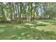 Scenic front yard with tall trees providing shade and privacy at 535 Black Ironwood Dr, Deland, FL 32724