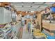 Organized garage with ample storage shelving and workspace, suitable for various projects at 535 Black Ironwood Dr, Deland, FL 32724