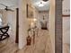 Hallway with wood floors and decorative table at 535 Black Ironwood Dr, Deland, FL 32724