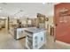 Large open kitchen with island and granite countertops with tiled floors at 535 Black Ironwood Dr, Deland, FL 32724