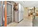 Pantry and coatrack are adjacent to kitchen door in a rustic motif at 535 Black Ironwood Dr, Deland, FL 32724