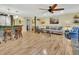 Open concept living space showcasing hardwood floors and seamless transition to the kitchen area at 535 Black Ironwood Dr, Deland, FL 32724