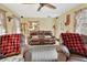 Comfortable living room with two brown leather recliners and view of the dining room and kitchen at 535 Black Ironwood Dr, Deland, FL 32724