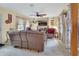 Spacious living room with decorative curtains and wood accent wall with mounted tv at 535 Black Ironwood Dr, Deland, FL 32724