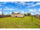 View of the yard, fence and back of the house at 6 Laurel Pass Ct, Ocala, FL 34480