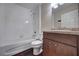 Bathroom featuring a shower and tub combo, toilet, vanity and a dark wood floor at 6 Laurel Pass Ct, Ocala, FL 34480