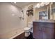 Bathroom with tiled walk-in shower, toilet, and vanity with sink at 6 Laurel Pass Ct, Ocala, FL 34480