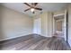 A bright bedroom features wood-look flooring and a ceiling fan for added comfort at 6 Laurel Pass Ct, Ocala, FL 34480