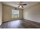 Bedroom featuring laminate flooring, ceiling fan and window with natural light at 6 Laurel Pass Ct, Ocala, FL 34480
