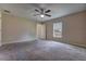Carpeted bedroom with a ceiling fan and window with natural light at 6 Laurel Pass Ct, Ocala, FL 34480