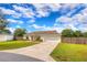 Charming single-story home featuring a two-car garage, a well-kept lawn, and inviting curb appeal at 6 Laurel Pass Ct, Ocala, FL 34480