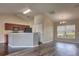 Open kitchen with dark cabinetry, a breakfast bar, and an open layout to the dining and living areas at 6 Laurel Pass Ct, Ocala, FL 34480