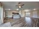 Open concept layout showing the living room, kitchen, and dining area, with vaulted ceilings and wood flooring at 6 Laurel Pass Ct, Ocala, FL 34480