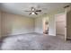 Bright main bedroom featuring neutral walls, ceiling fan and ensuite bathroom and walk-in closet at 6 Laurel Pass Ct, Ocala, FL 34480