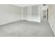 Spacious bedroom features light gray carpet and double closets for optimal storage at 600 N Boundary Ave # 110A, Deland, FL 32720