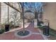 Charming courtyard entrance with red brick pathway and metal gates at 600 N Boundary Ave # 110A, Deland, FL 32720