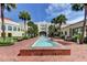 Courtyard with benches and mature landscaping and a fountain at 600 N Boundary Ave # 110A, Deland, FL 32720