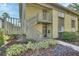 Condominium with well maintained exteriors, entrance stairs, and beautiful landscaping at 600 N Boundary Ave # 110A, Deland, FL 32720
