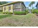 A cozy condominium exterior with lush green lawn and mature trees at 600 N Boundary Ave # 110A, Deland, FL 32720