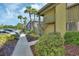 Exterior shot of a condominium with meticulous landscaping at 600 N Boundary Ave # 110A, Deland, FL 32720