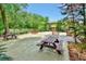 Condominium area featuring picnic tables and seating under mature trees at 600 N Boundary Ave # 110A, Deland, FL 32720