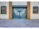 Exterior view of a garage door with angel wings art between two windows at 600 N Boundary Ave # 110A, Deland, FL 32720