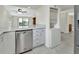 Kitchen featuring stainless steel dishwasher, granite counter tops, and open view of the living room at 600 N Boundary Ave # 110A, Deland, FL 32720