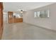 Bright and airy living room with tile floors and a view of the modern, remodeled kitchen at 600 N Boundary Ave # 110A, Deland, FL 32720