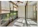 Bright sunroom with tile floor and multiple windows offering abundant natural light at 600 N Boundary Ave # 110A, Deland, FL 32720