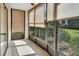 Inviting sunroom with large windows and tile flooring, perfect for relaxation at 600 N Boundary Ave # 110A, Deland, FL 32720