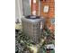 Modern air conditioning unit surrounded by lush greenery, ensuring efficient climate control for the property at 621 W Indiana Ave # 13, Deland, FL 32720