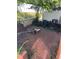 Backyard with an air conditioner and a brick ground and a white fence at 621 W Indiana Ave # 13, Deland, FL 32720