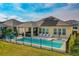 Backyard view showcasing a sparkling pool and outdoor patio area perfect for entertaining at 6871 Forkmead Ln, Port Orange, FL 32128