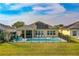 Backyard view showcasing a sparkling pool and outdoor patio area perfect for entertaining at 6871 Forkmead Ln, Port Orange, FL 32128