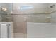 Beautiful bathroom featuring a glass shower with a tiled design and rain showerhead at 6871 Forkmead Ln, Port Orange, FL 32128