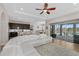 Open-concept living room with a modern kitchen, dining area, and access to an outdoor patio at 6871 Forkmead Ln, Port Orange, FL 32128