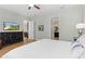 Main bedroom showcases the beautiful flooring, ceiling fan, and ensuite bathroom at 6871 Forkmead Ln, Port Orange, FL 32128