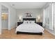 Lovely primary bedroom suite features an en-suite bathroom, king size bed, and bright windows at 6871 Forkmead Ln, Port Orange, FL 32128